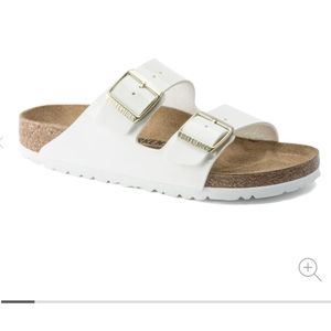 Birkenstock - Arizona patent white with gold buckles.